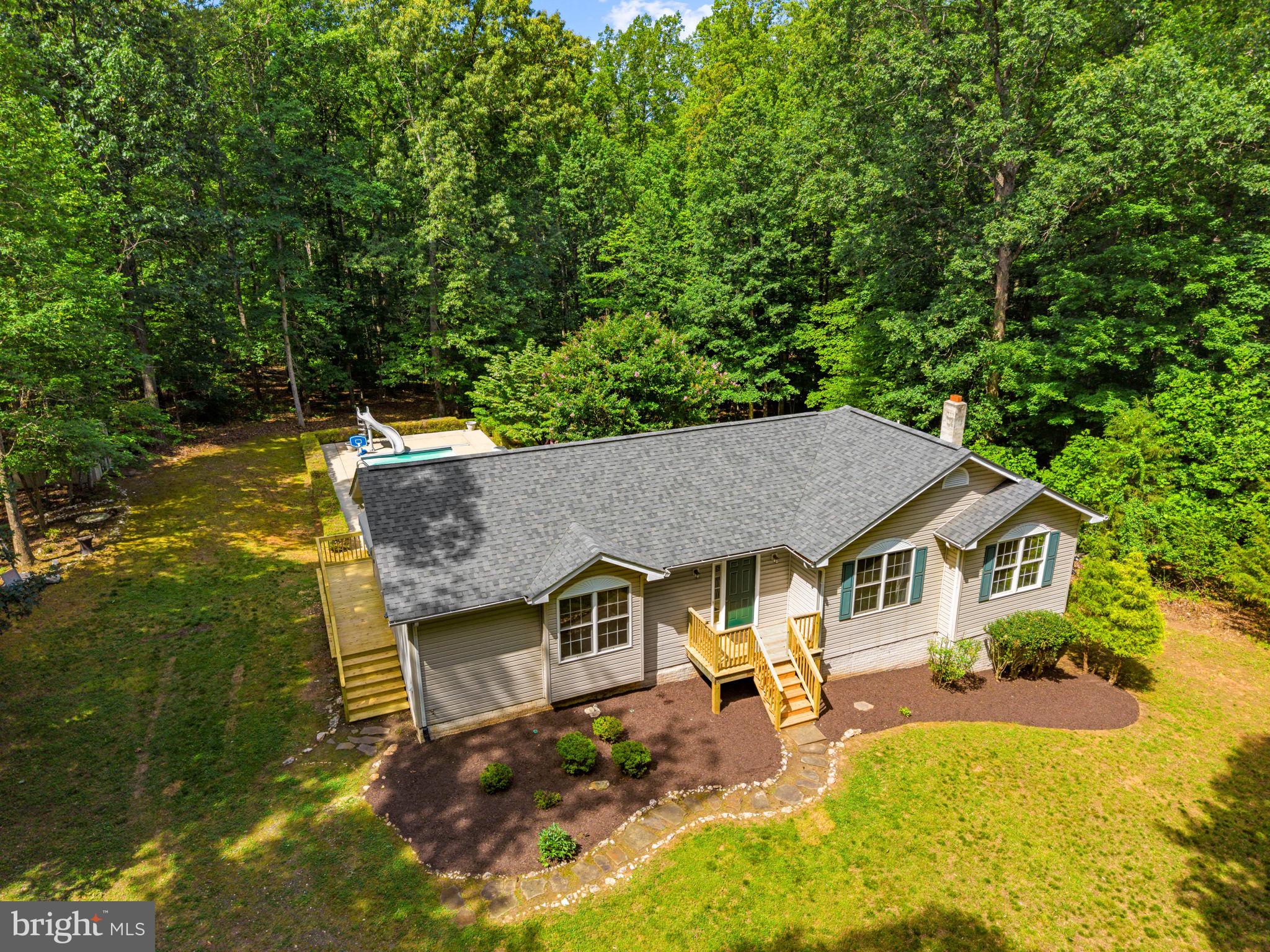 20065 Crooked Run Road Culpeper, VA 22701 - Photo 60 of 62 a aerial view of a house with swimming pool and sitting area