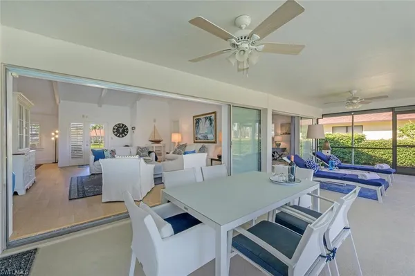 a view of a dining room with furniture window and outside view