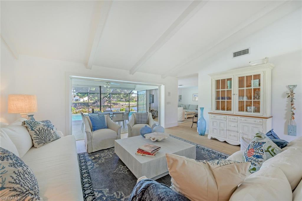 239 Torrey Pines Point Naples, FL 34113 - Photo 16 of 46 a living room with furniture and a window