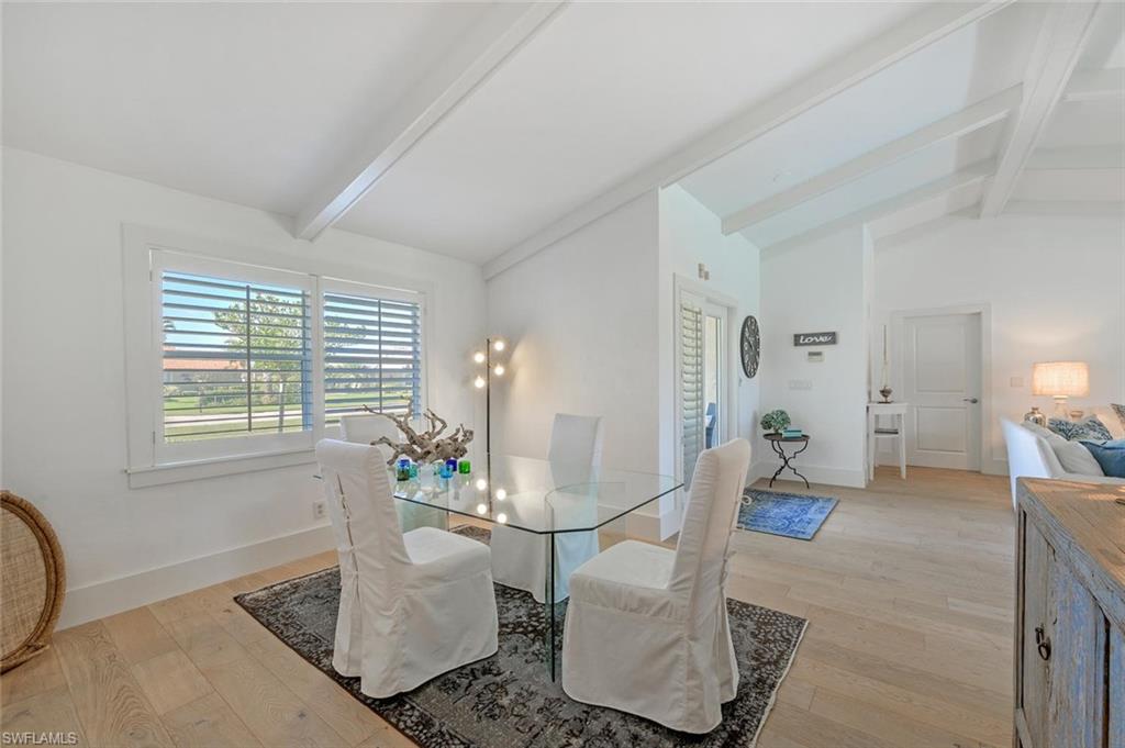 239 Torrey Pines Point Naples, FL 34113 - Photo 19 of 46 a living room with furniture and wooden floor