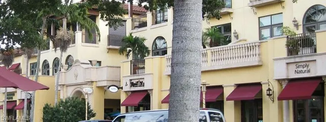 an aerial view of multiple houses with yard