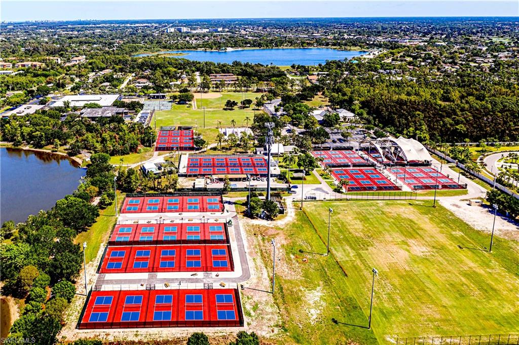 239 Torrey Pines Point Naples, FL 34113 - Photo 40 of 46 an aerial view of multiple houses with yard