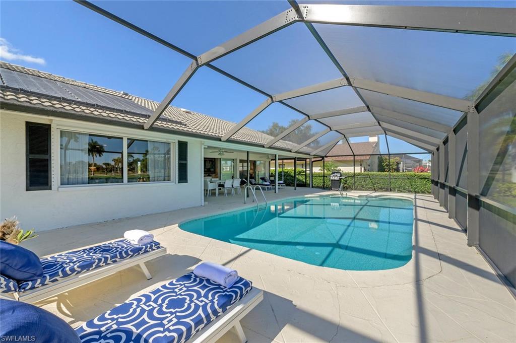 239 Torrey Pines Point Naples, FL 34113 - Photo 9 of 46 a view of a backyard with couches potted plants