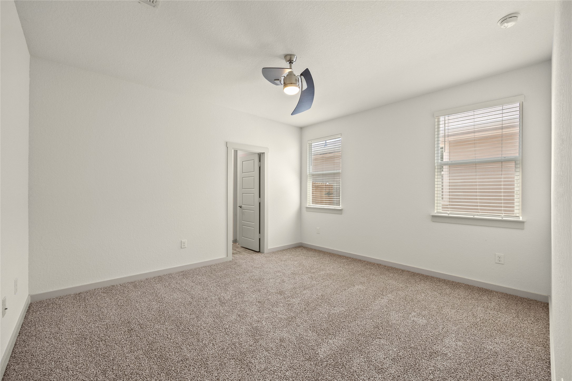 10307 Criswell Road Austin, TX 78754 - Photo 13 of 35 Home features contemporary ceiling fans, a large windows throughout--loads of natural light!
