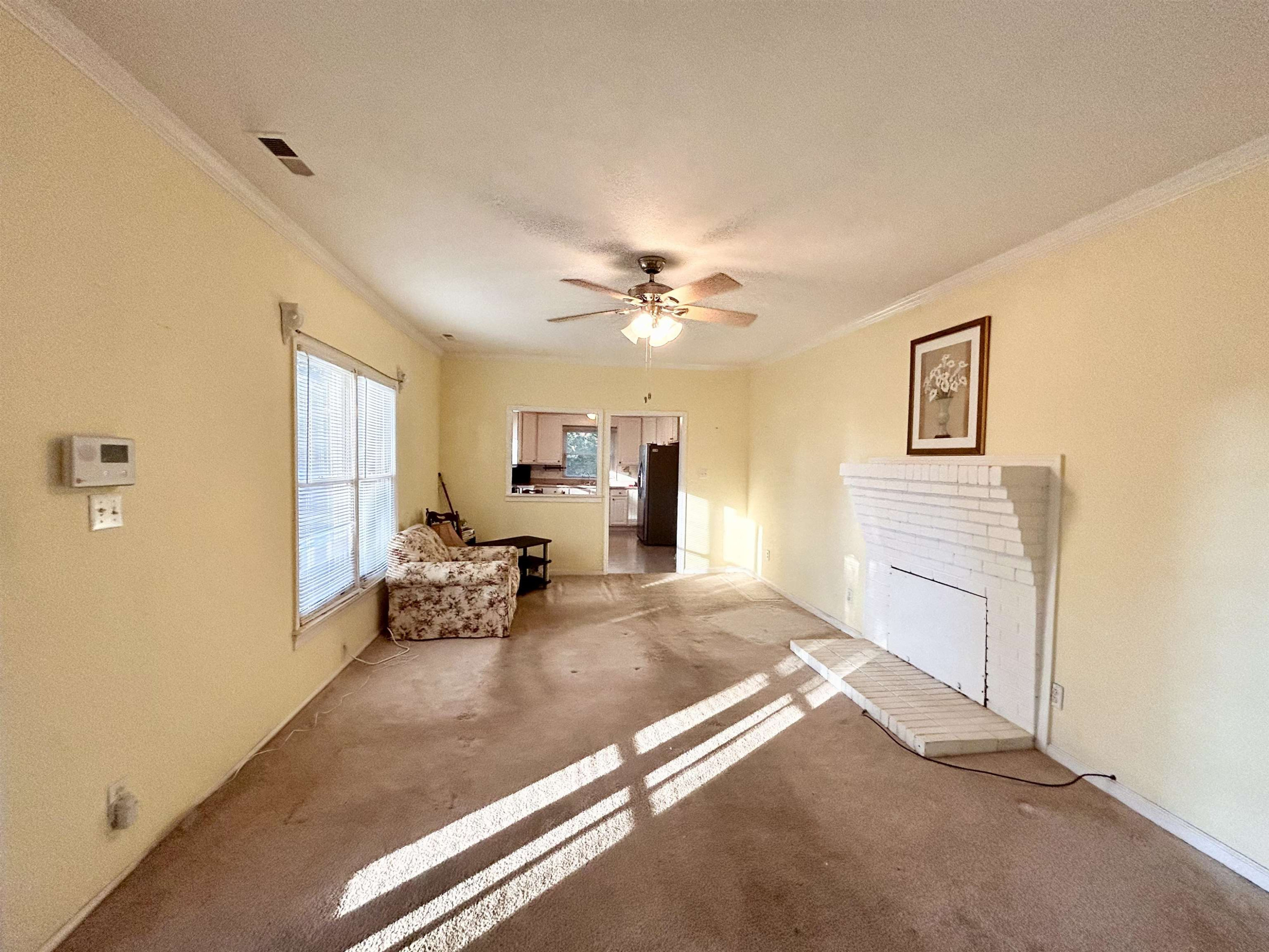 25 Burton Avenue Raleigh, NC 27606 - Photo 3 of 24 a view of livingroom with furniture and ceiling fan