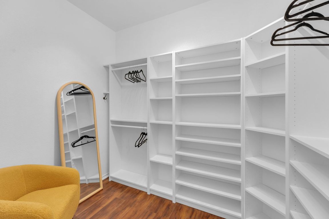 8901 Meridian Oak Lane Austin, TX 78744 - Photo 17 of 26 a view of walk in closet with clothes and shoes