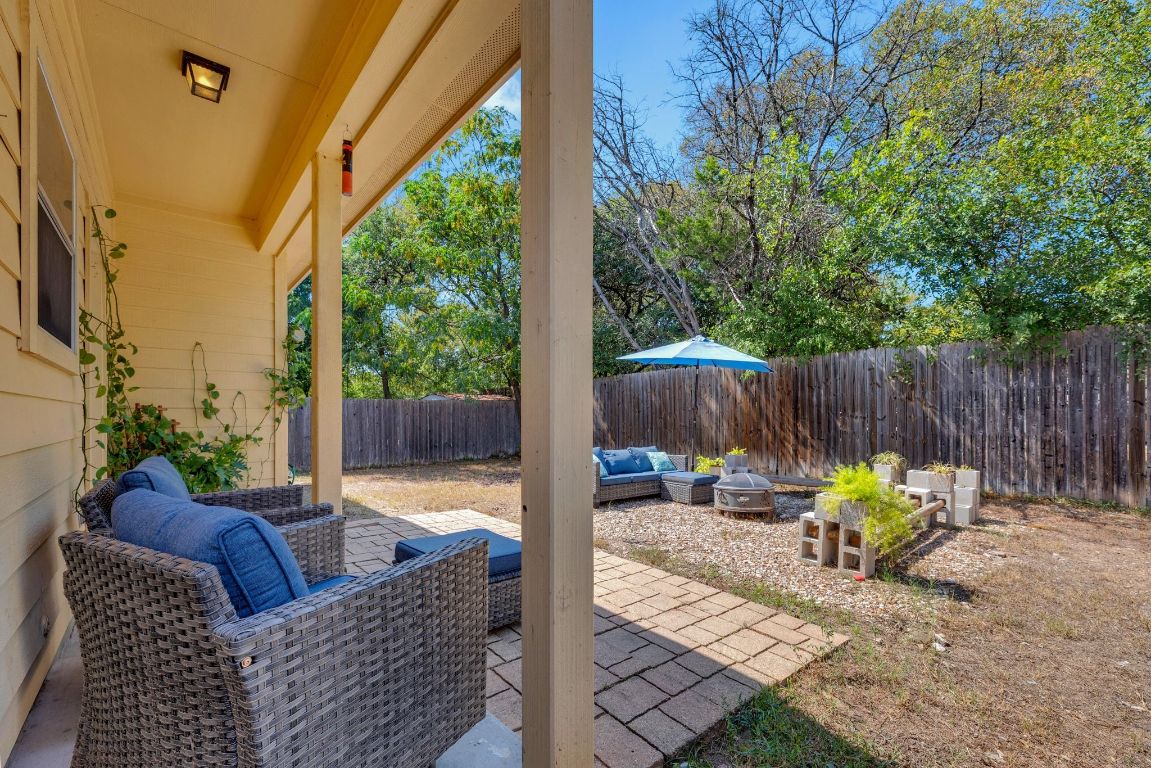 8901 Meridian Oak Lane Austin, TX 78744 - Photo 23 of 26 a view of patio with wooden chairs