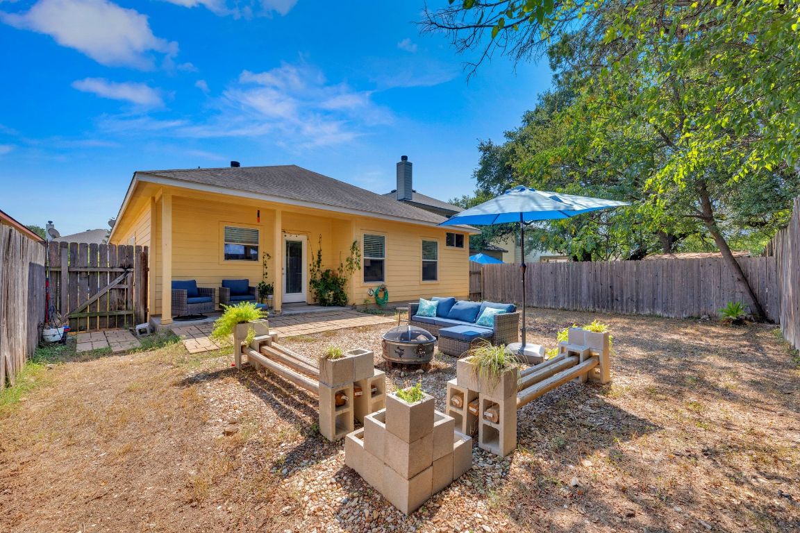 8901 Meridian Oak Lane Austin, TX 78744 - Photo 24 of 26 a view of a house with backyard and sitting area