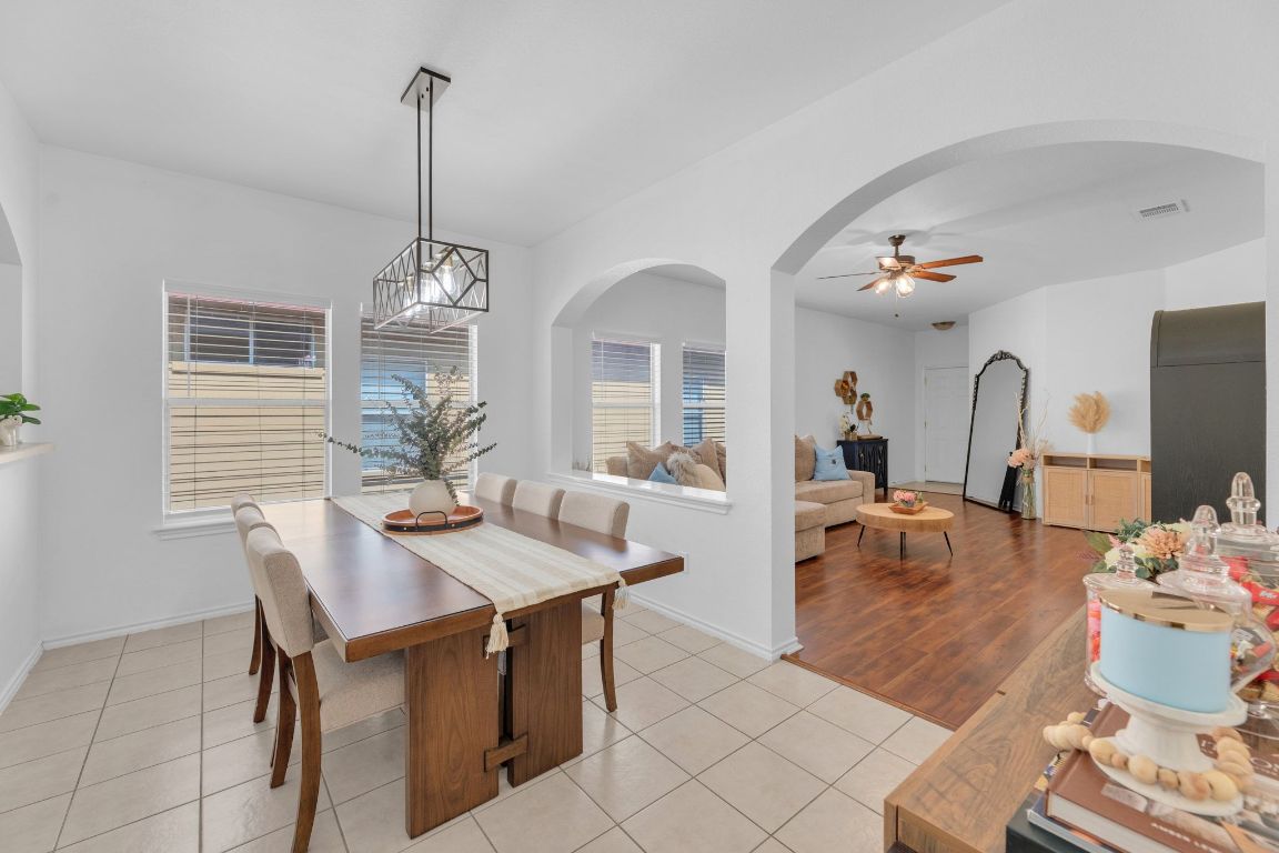 8901 Meridian Oak Lane Austin, TX 78744 - Photo 8 of 26 a view of a dining room with furniture window and wooden floor