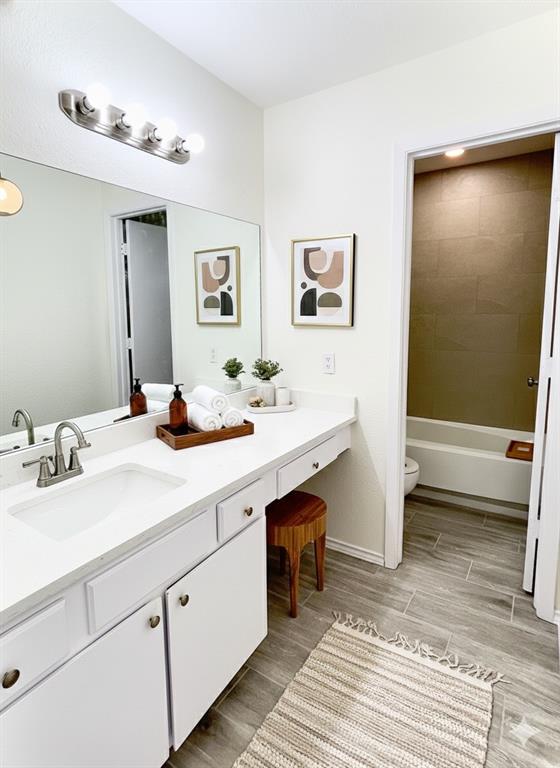 1508 Grantbrook Lane Dallas, TX 75228 - Photo 6 of 11 a bathroom with a sink double vanity and a mirror