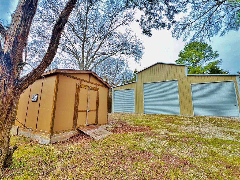 236 Homesite Road Pottsboro, TX 75076 - Photo 12 of 40 a view of a house with a yard
