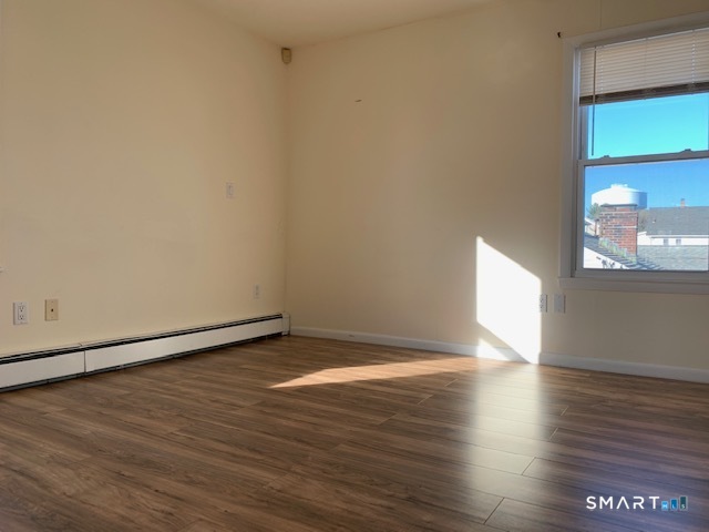 23 Fairview Avenue, Unit 2 Norwalk, CT 06850 - Photo 12 of 15 a view of an empty room and window