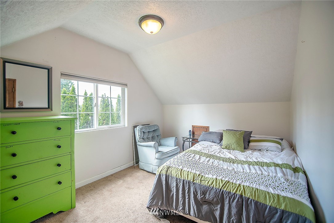 1009 Hilltop Road Winlock, WA 98596 - Photo 12 of 22 a bedroom with a bed and window