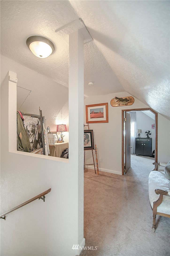 1009 Hilltop Road Winlock, WA 98596 - Photo 15 of 22 a view of a hallway with paintings on the wall