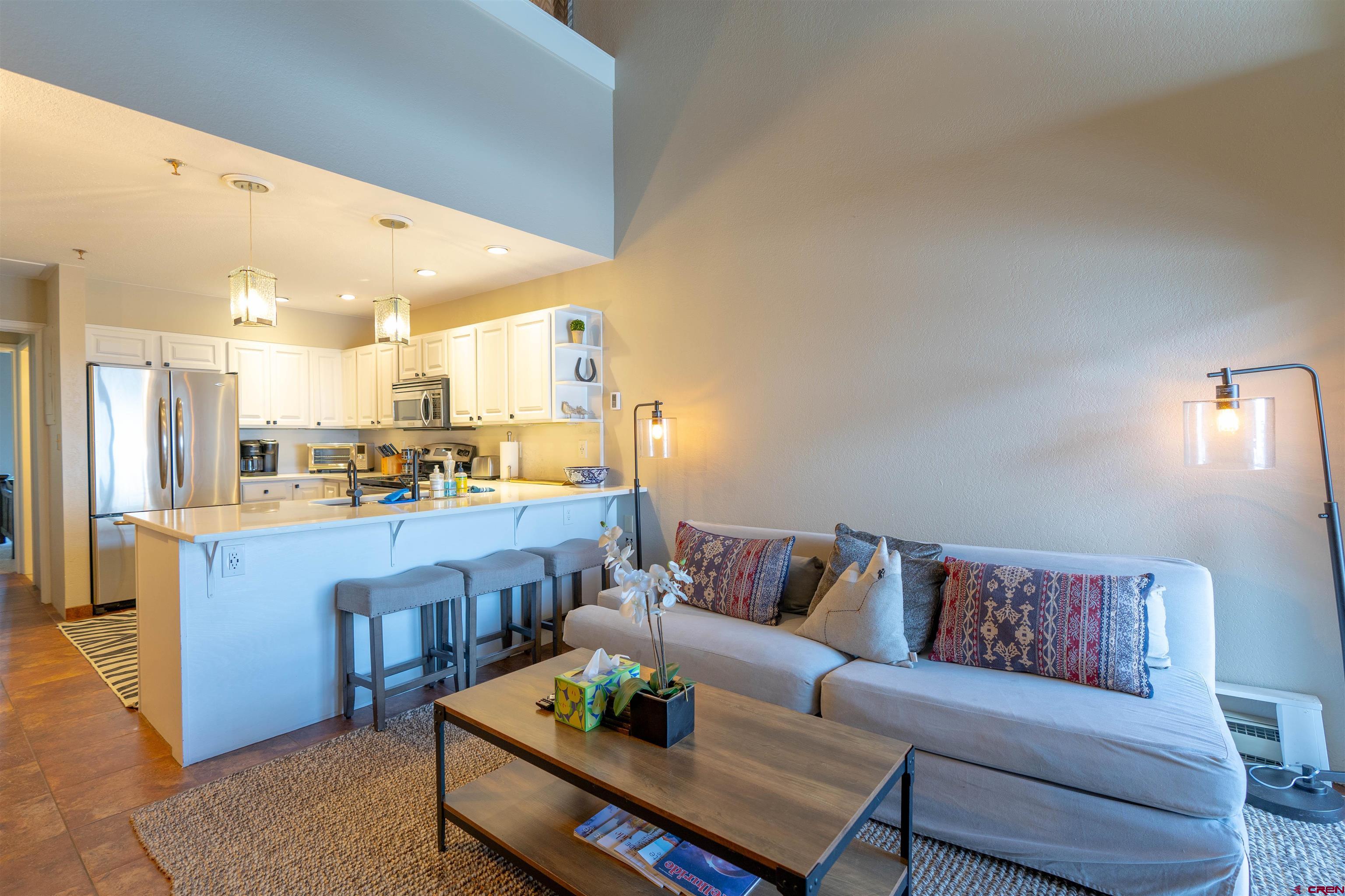 12 Snowmass Road, Unit 414 Crested Butte, CO 81225 - Photo 17 of 33 a living room with furniture and kitchen view