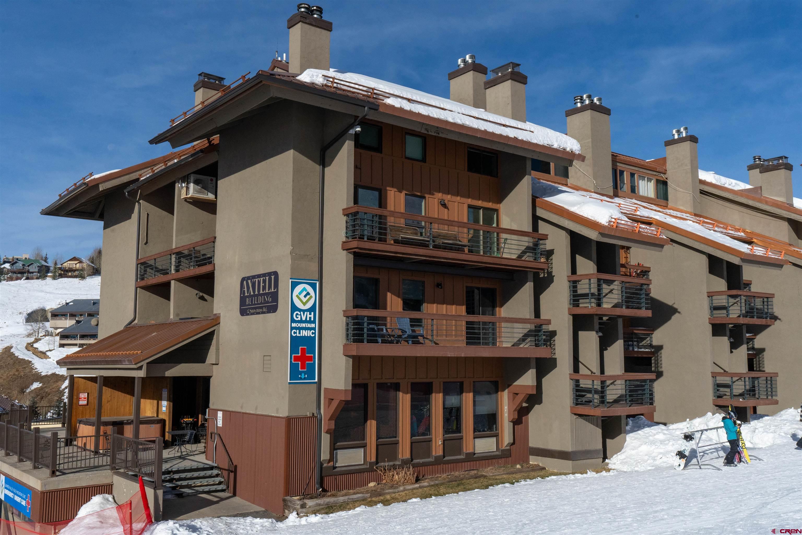 12 Snowmass Road, Unit 414 Crested Butte, CO 81225 - Photo 2 of 33 front view of a house with a street