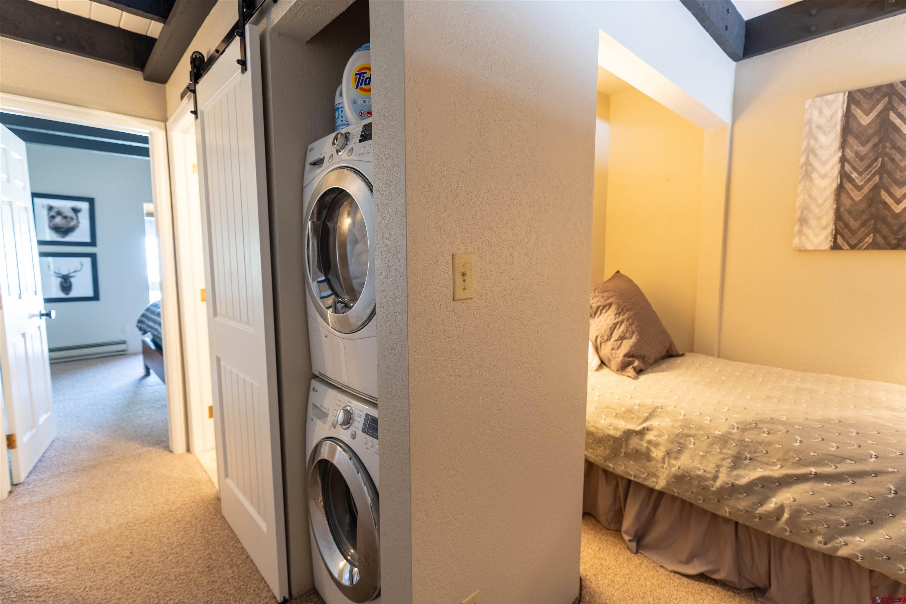 12 Snowmass Road, Unit 414 Crested Butte, CO 81225 - Photo 33 of 33 a view of a bedroom with washer and dryer