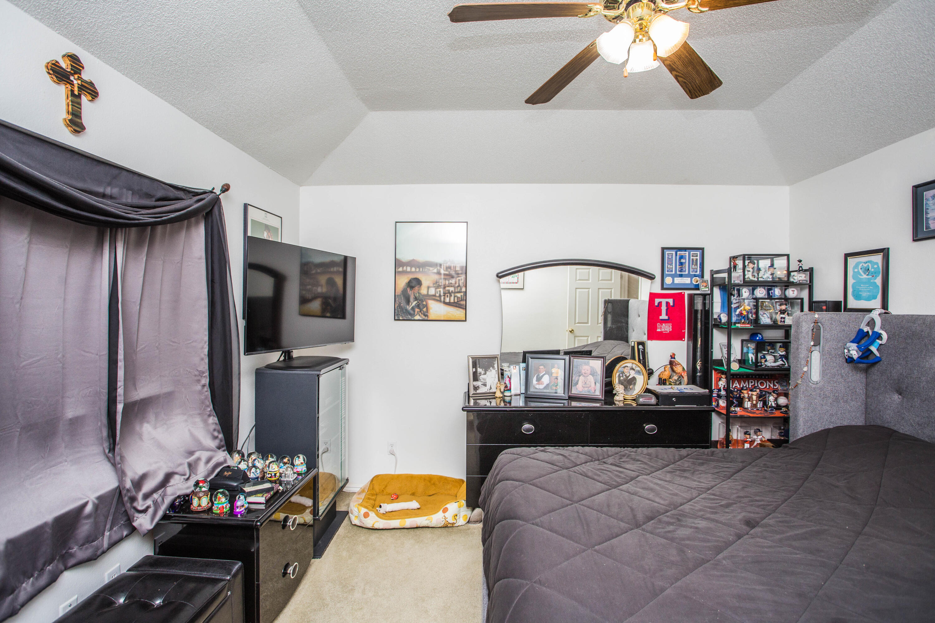 906 Xavier Street, Unit 1 Lubbock, TX 79403 - Photo 12 of 46 a bedroom with furniture and a bed