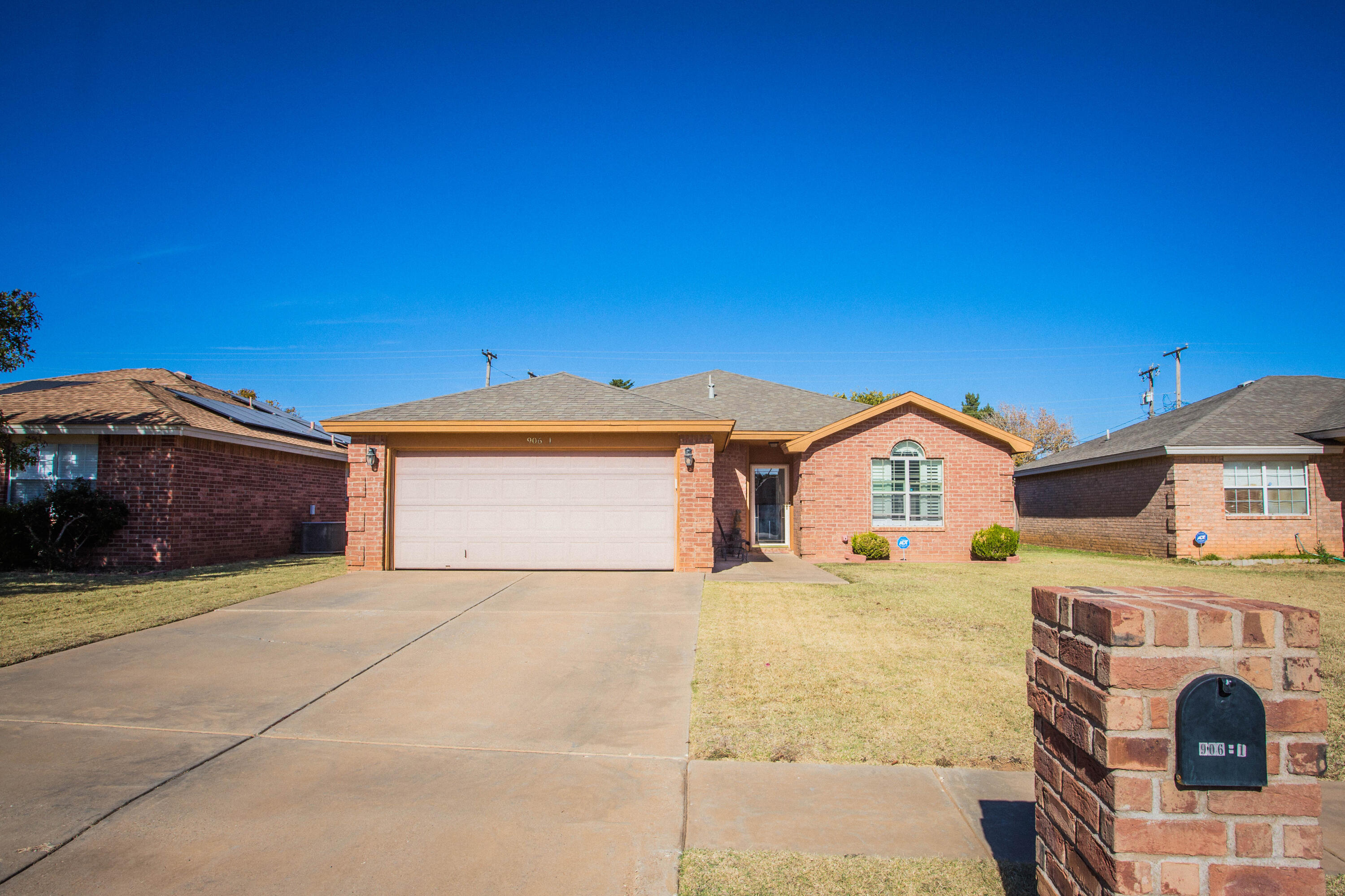 906 Xavier Street, Unit 1 Lubbock, TX 79403 - Photo 2 of 46 a view of a house with a yard