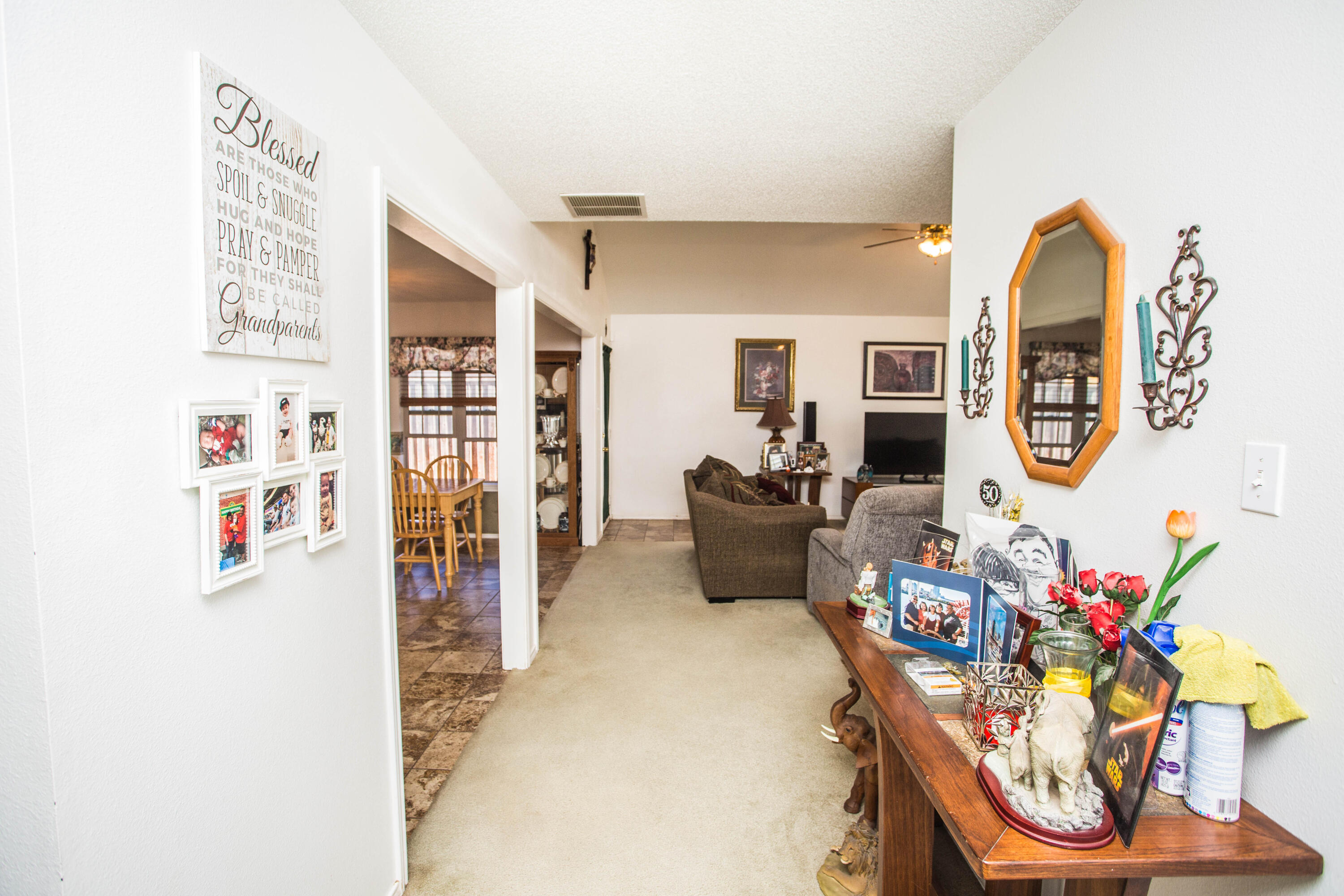 906 Xavier Street, Unit 1 Lubbock, TX 79403 - Photo 27 of 46 a living room with furniture and a flat screen tv