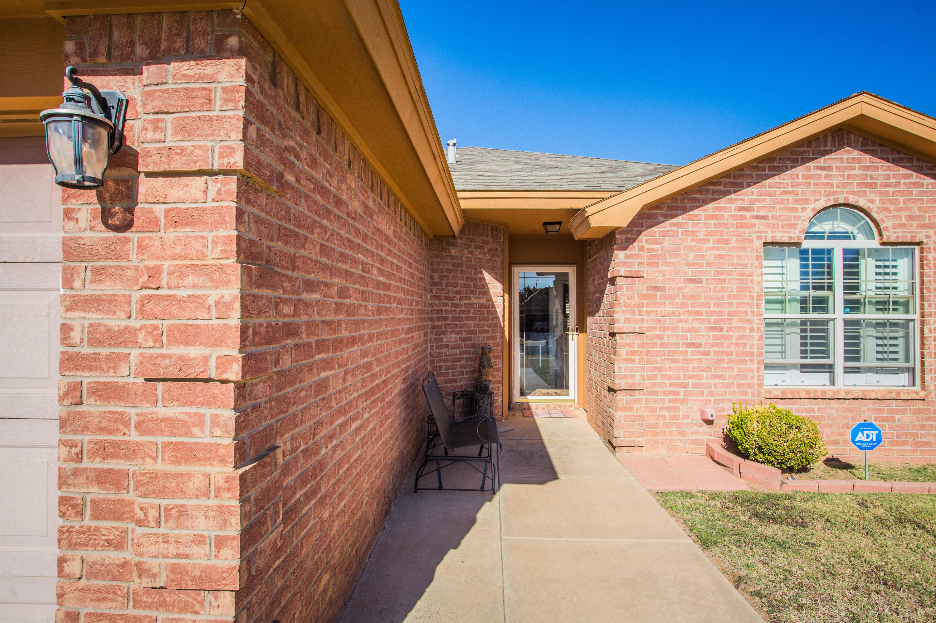 906 Xavier Street, Unit 1 Lubbock, TX 79403 - Photo 3 of 46 a front view of a house with a yard