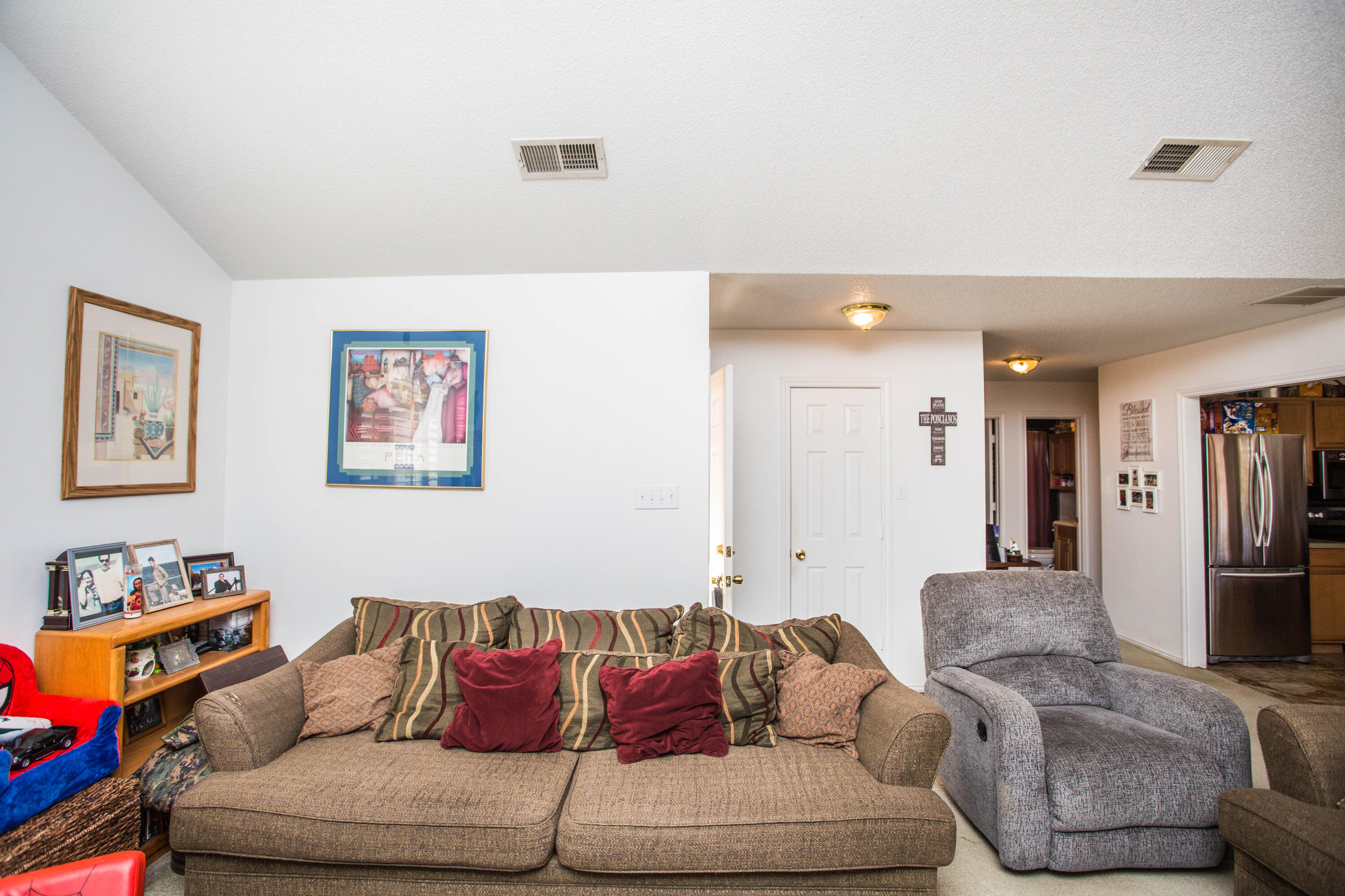 906 Xavier Street, Unit 1 Lubbock, TX 79403 - Photo 33 of 46 a living room with furniture and a couch