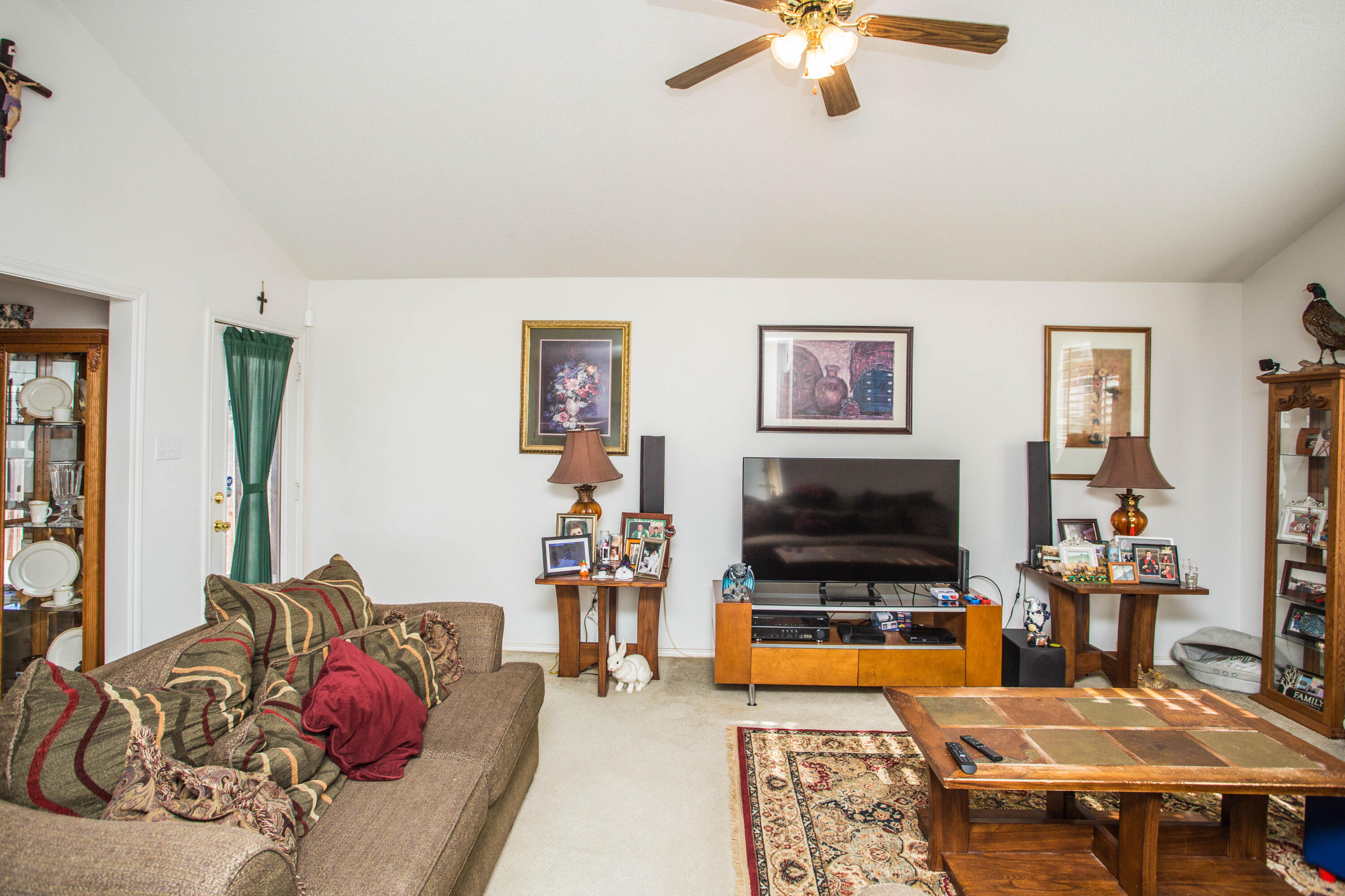 906 Xavier Street, Unit 1 Lubbock, TX 79403 - Photo 4 of 46 a living room with furniture and a flat screen tv
