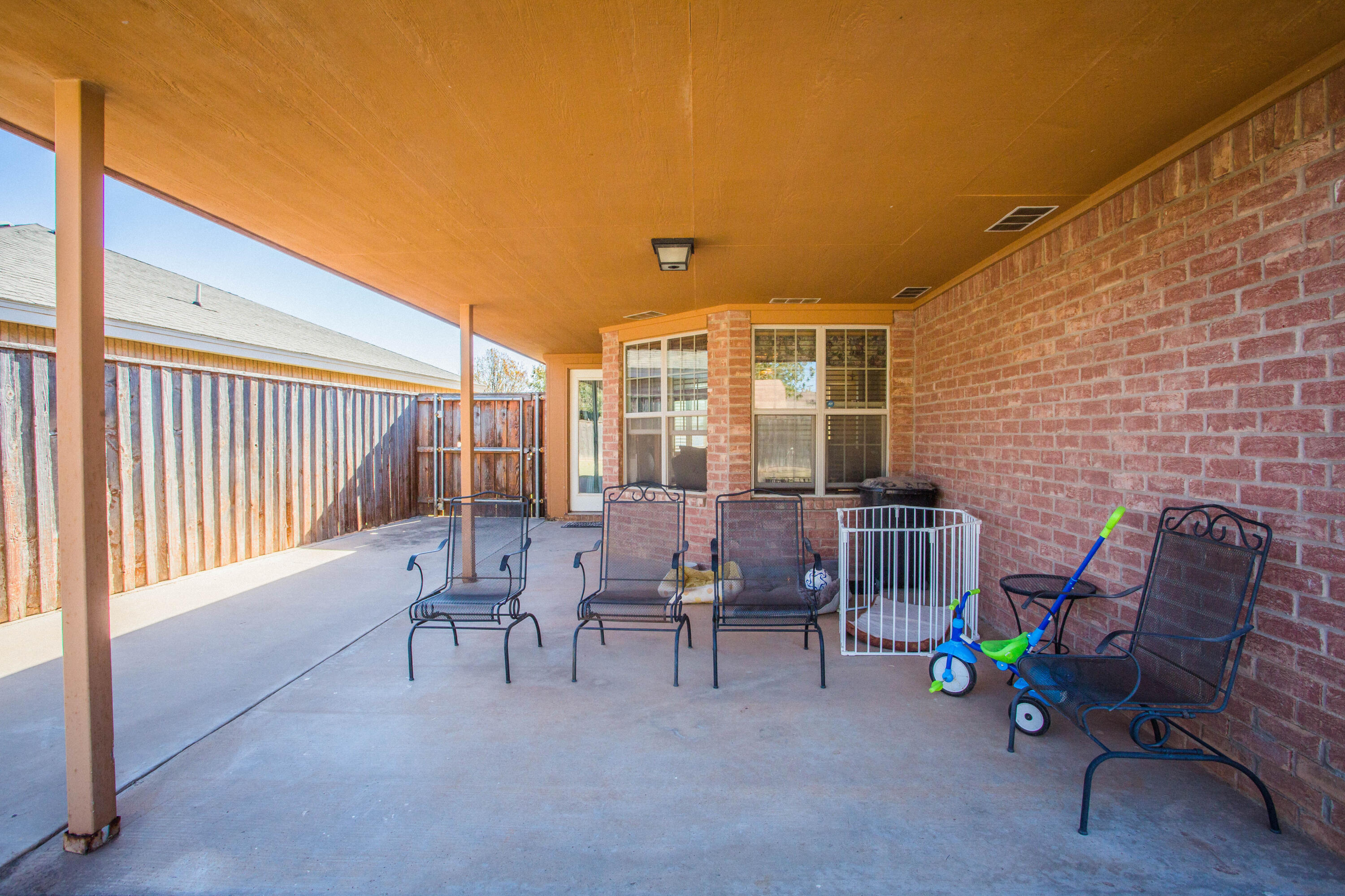 906 Xavier Street, Unit 1 Lubbock, TX 79403 - Photo 41 of 46 a balcony with chairs and with potted plants