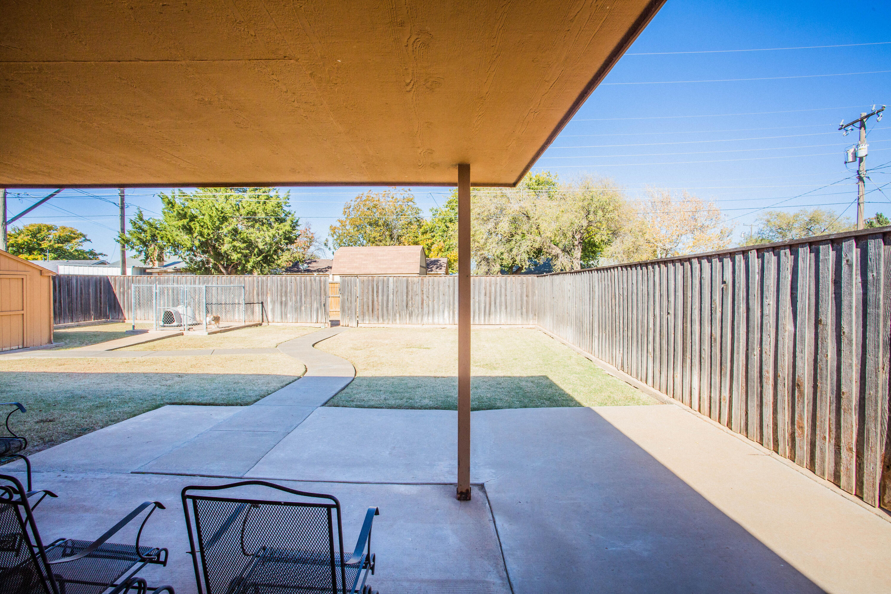 906 Xavier Street, Unit 1 Lubbock, TX 79403 - Photo 44 of 46 a view of backyard with swimming pool and outdoor seating