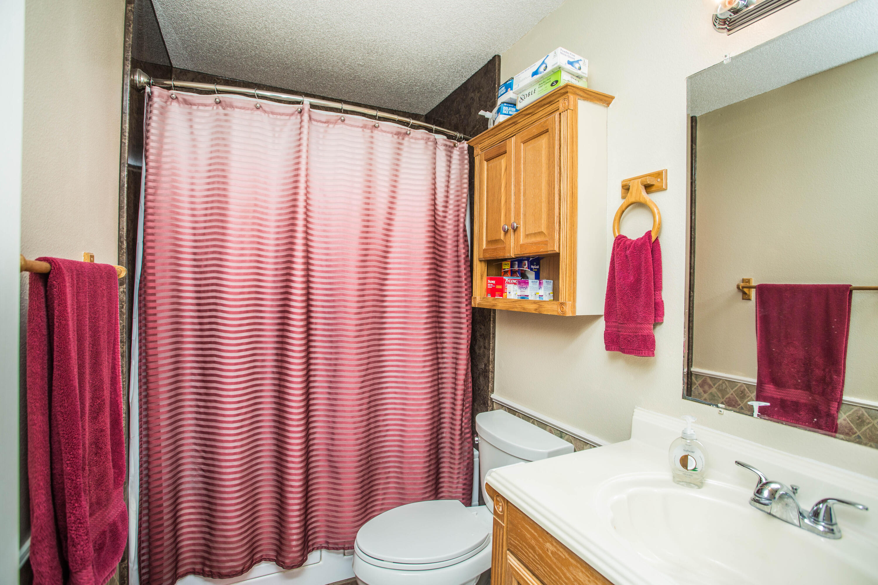906 Xavier Street, Unit 1 Lubbock, TX 79403 - Photo 6 of 46 a bathroom with a sink toilet and shower
