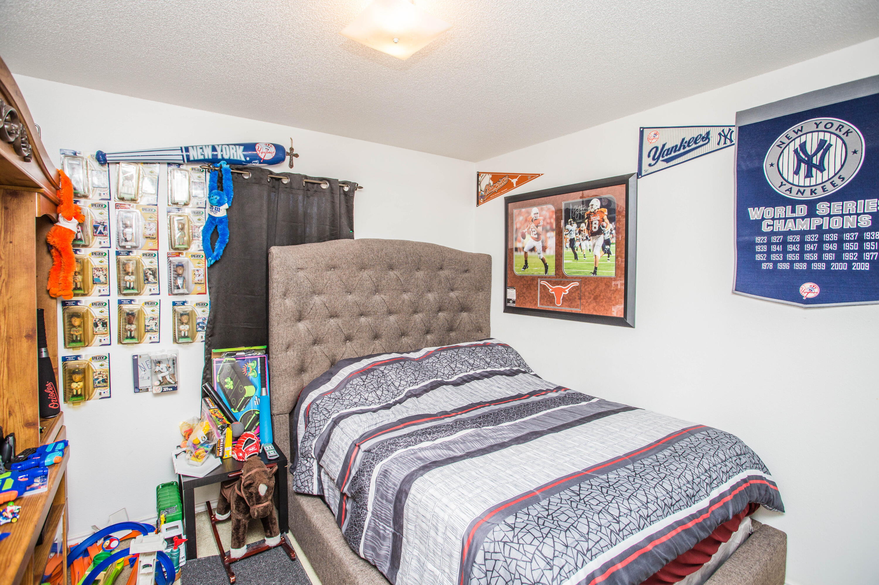 906 Xavier Street, Unit 1 Lubbock, TX 79403 - Photo 8 of 46 a bed room with a bed and a couch