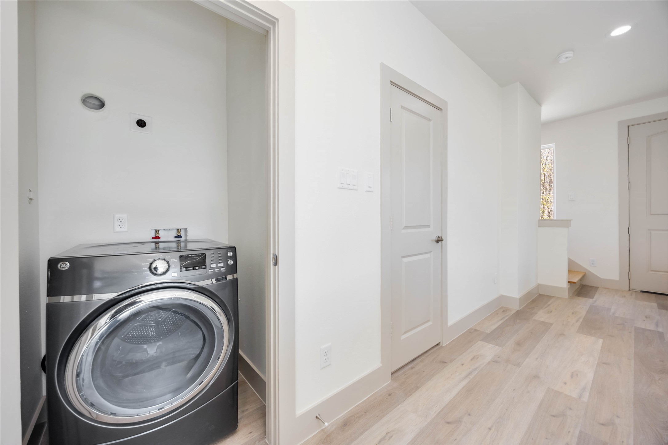 3206 Retta Street Houston, TX 77026 - Photo 11 of 19 a view of a hallway with washer and dryer