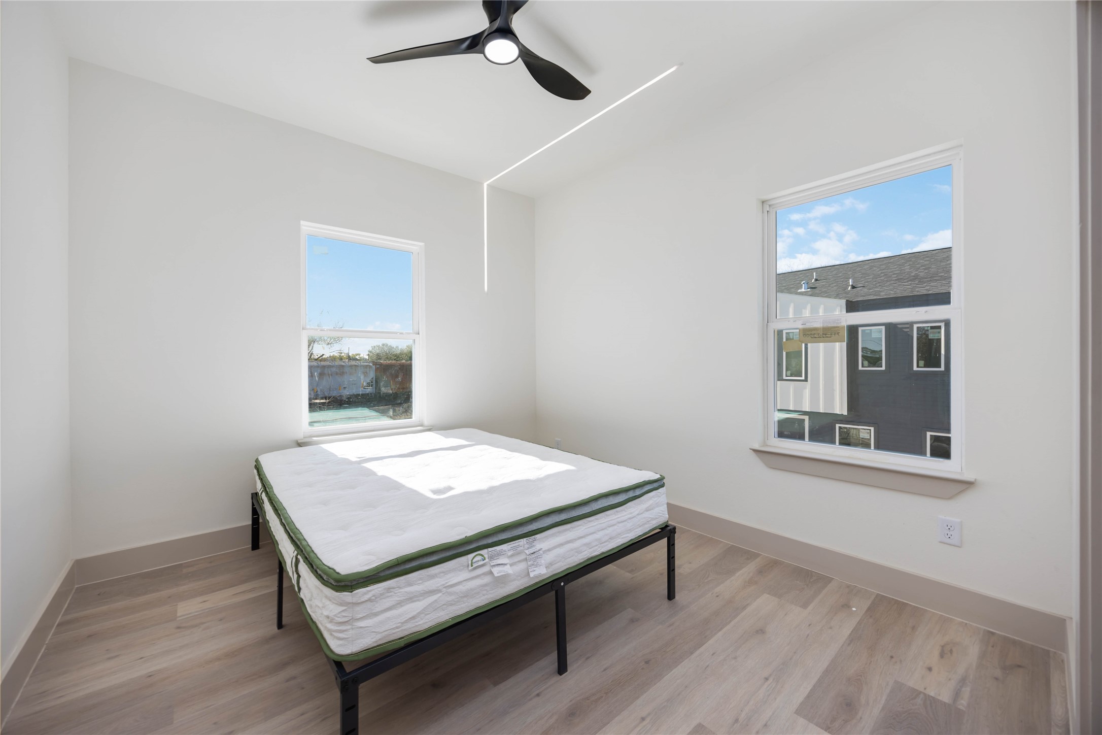 3206 Retta Street Houston, TX 77026 - Photo 14 of 19 a room with a table chairs and wooden floor