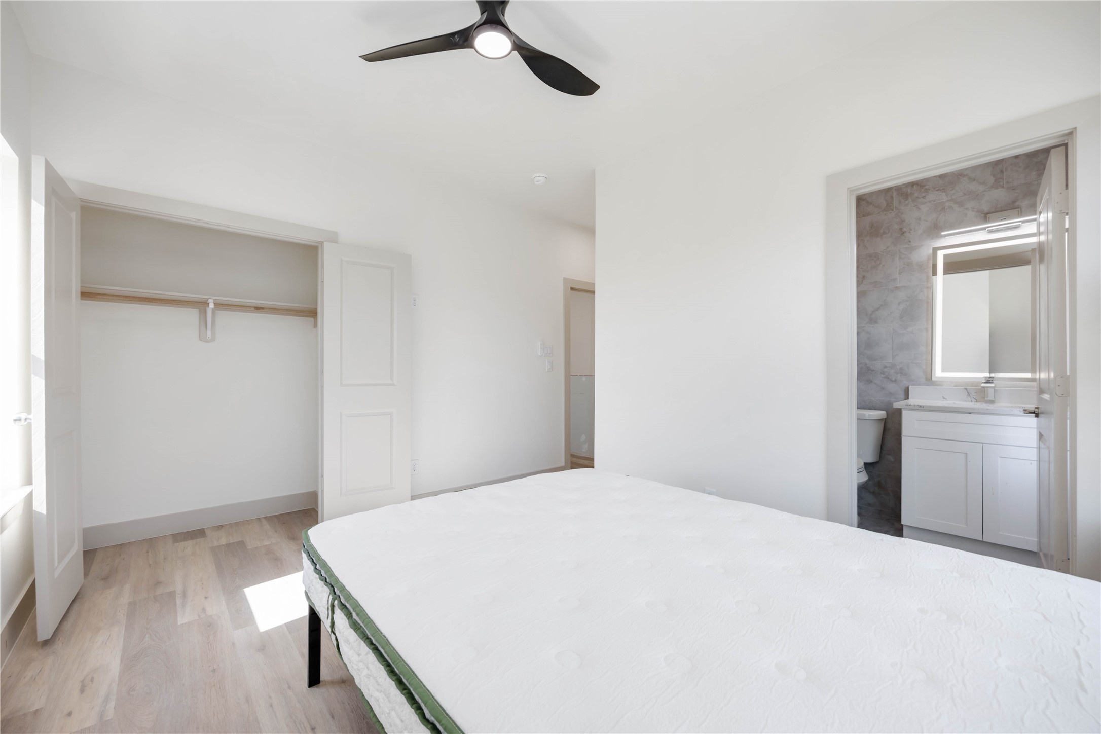 3206 Retta Street Houston, TX 77026 - Photo 16 of 19 a bedroom with a bed and cabinets