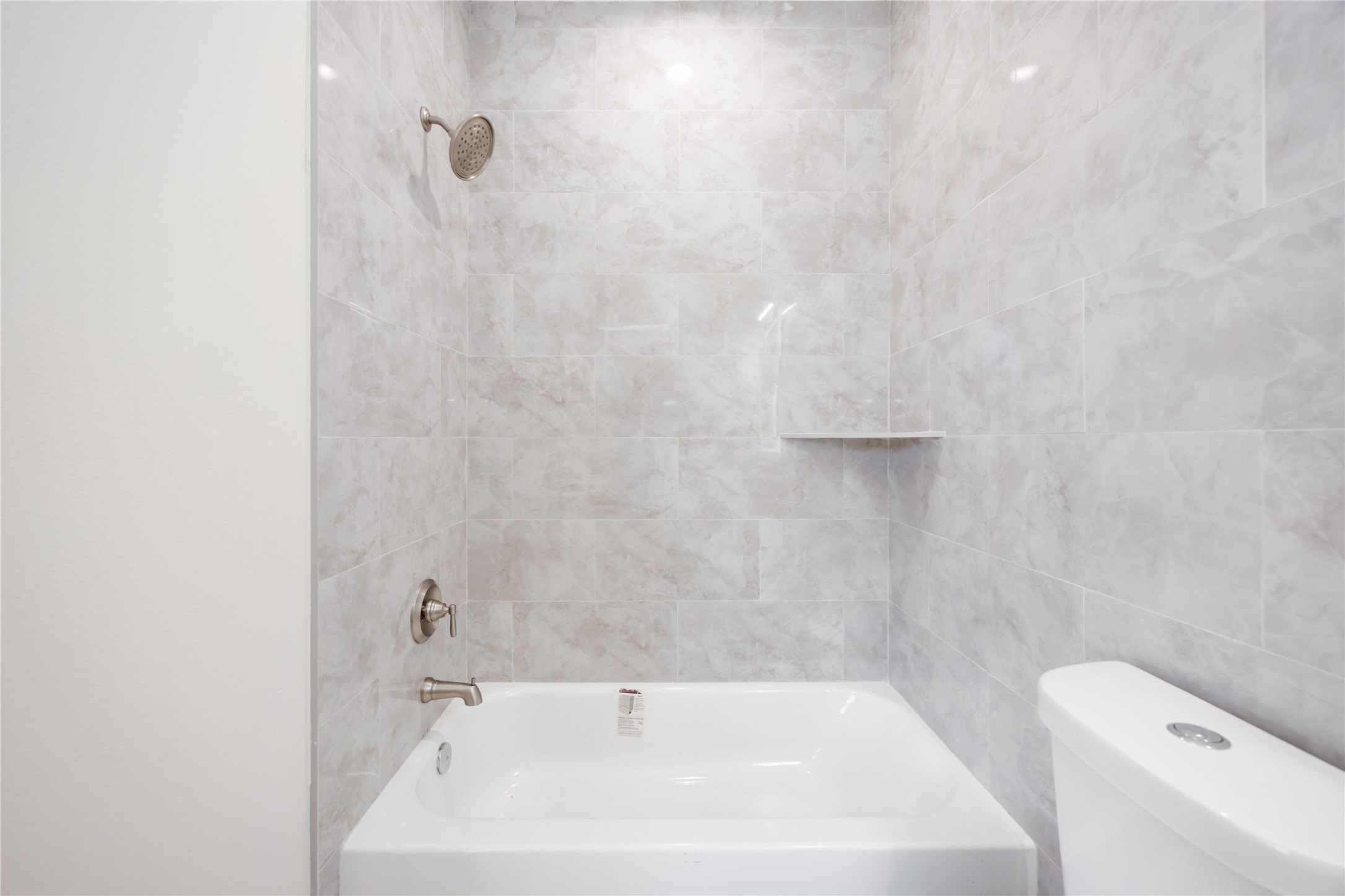 3206 Retta Street Houston, TX 77026 - Photo 18 of 19 a bathroom with a white bath tub and a white sink