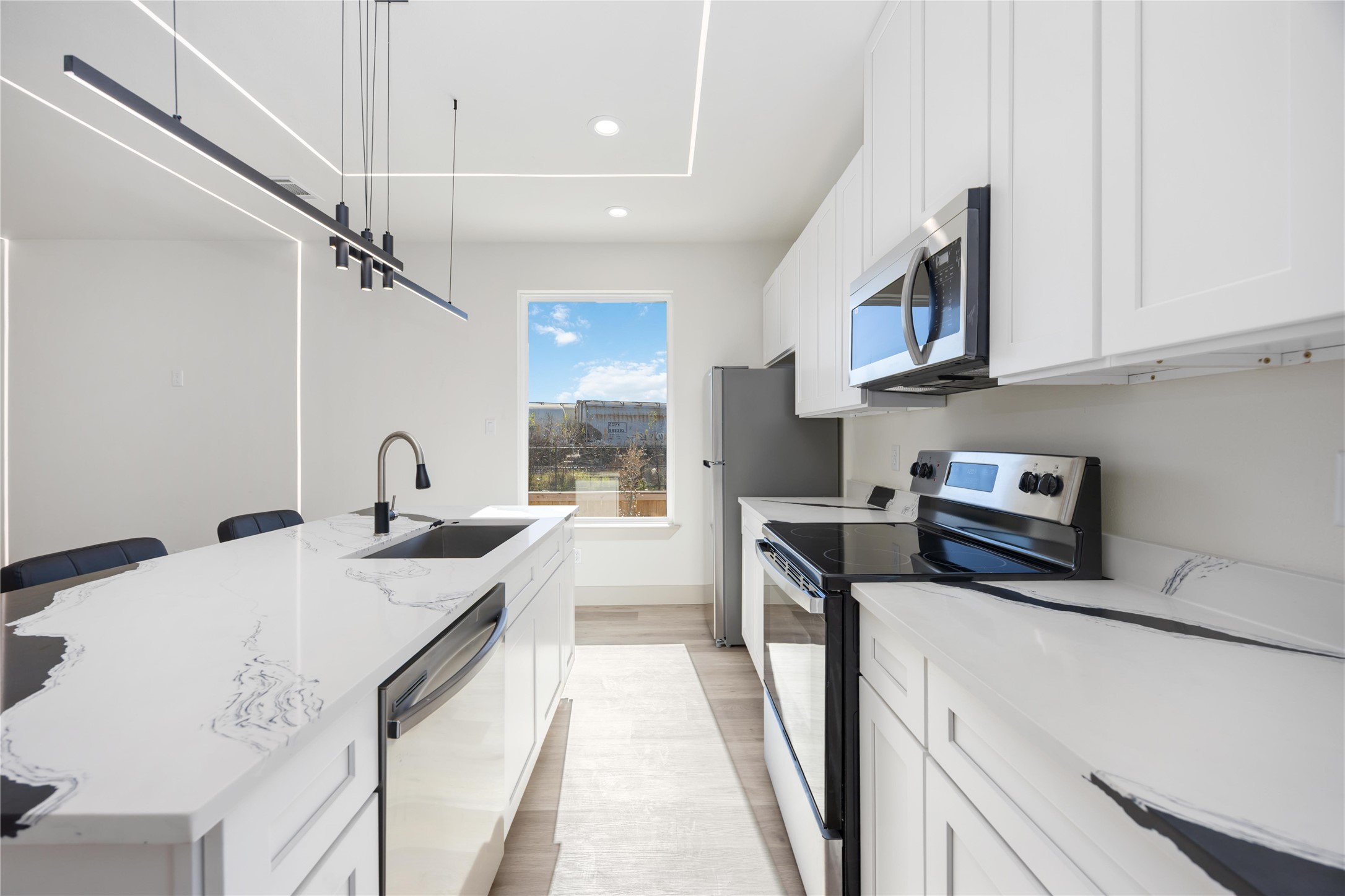3206 Retta Street Houston, TX 77026 - Photo 7 of 19 a kitchen with stainless steel appliances granite countertop a sink a stove and a refrigerator