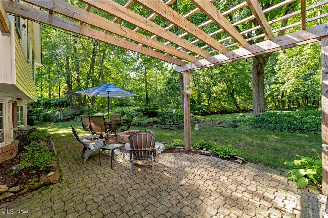 8062 Chagrin Road Chagrin Falls, OH 44023 - Photo 41 of 50 The paver patio offers an additional conversation area beneath the perfectly shade pergola—well-suited for relaxing or entertaining outdoors.