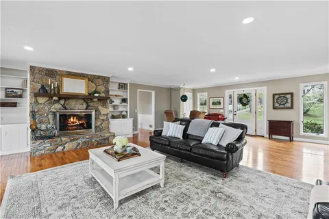 a kitchen with granite countertop white cabinets and stainless steel appliances