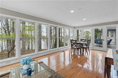 a view of living room with furniture and wooden floor