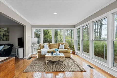 a view of a chairs and table on the wooden floor