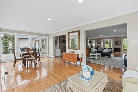 a spacious bedroom with a large bed and a flat screen tv