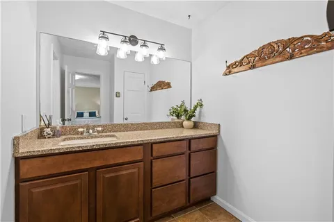 a bathroom with a toilet and a shower curtain