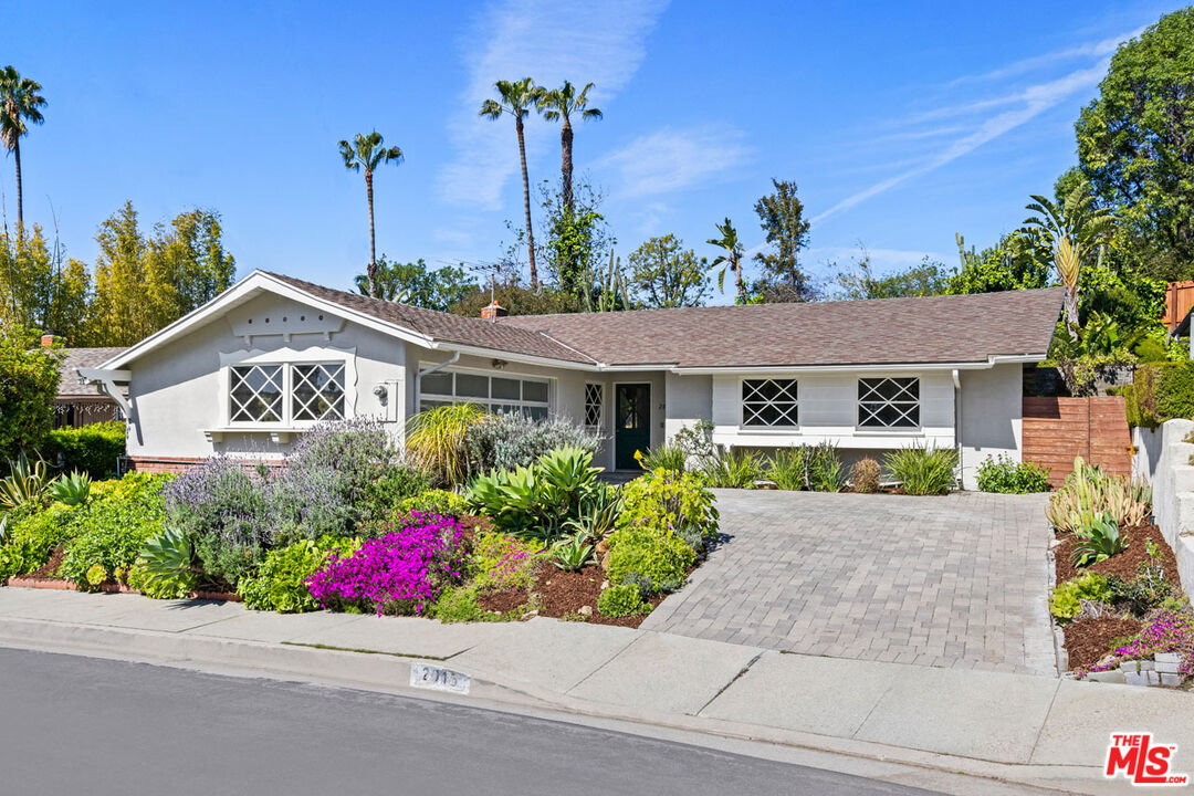 front view of a house with a small yard