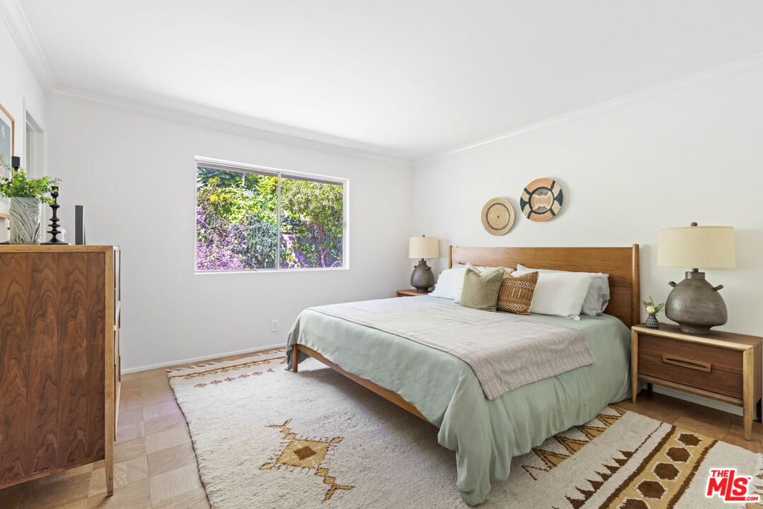 2015 Panamint Drive Los Angeles, CA 90065 - Photo 13 of 29 a bedroom with a bed and a painting on the wall