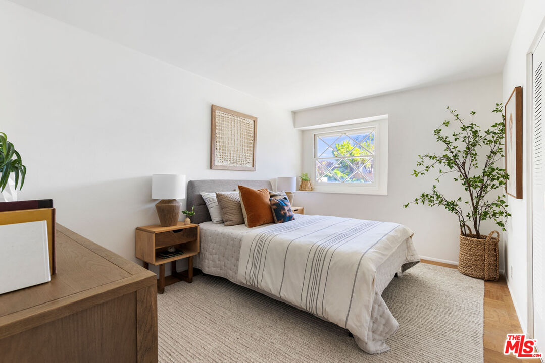 2015 Panamint Drive Los Angeles, CA 90065 - Photo 17 of 29 a bedroom with a bed and a potted plant