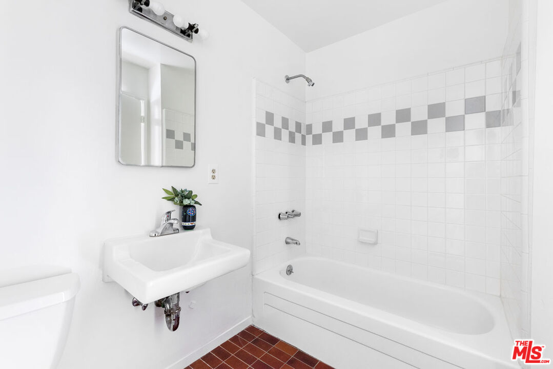 2015 Panamint Drive Los Angeles, CA 90065 - Photo 18 of 29 a bathroom with a sink a bathtub and a shower
