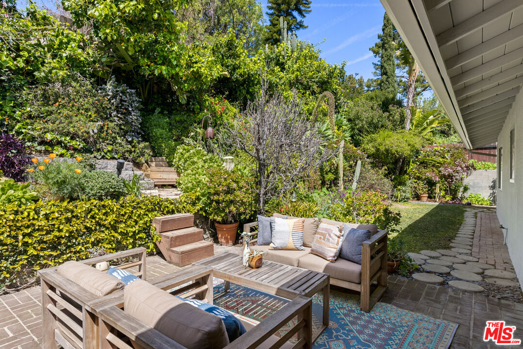 2015 Panamint Drive Los Angeles, CA 90065 - Photo 23 of 29 a view of a patio with table and chairs and potted plants