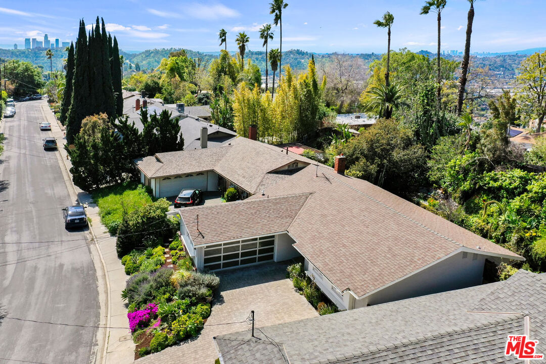 2015 Panamint Drive Los Angeles, CA 90065 - Photo 27 of 29 a view of a patio with table and chairs potted plants