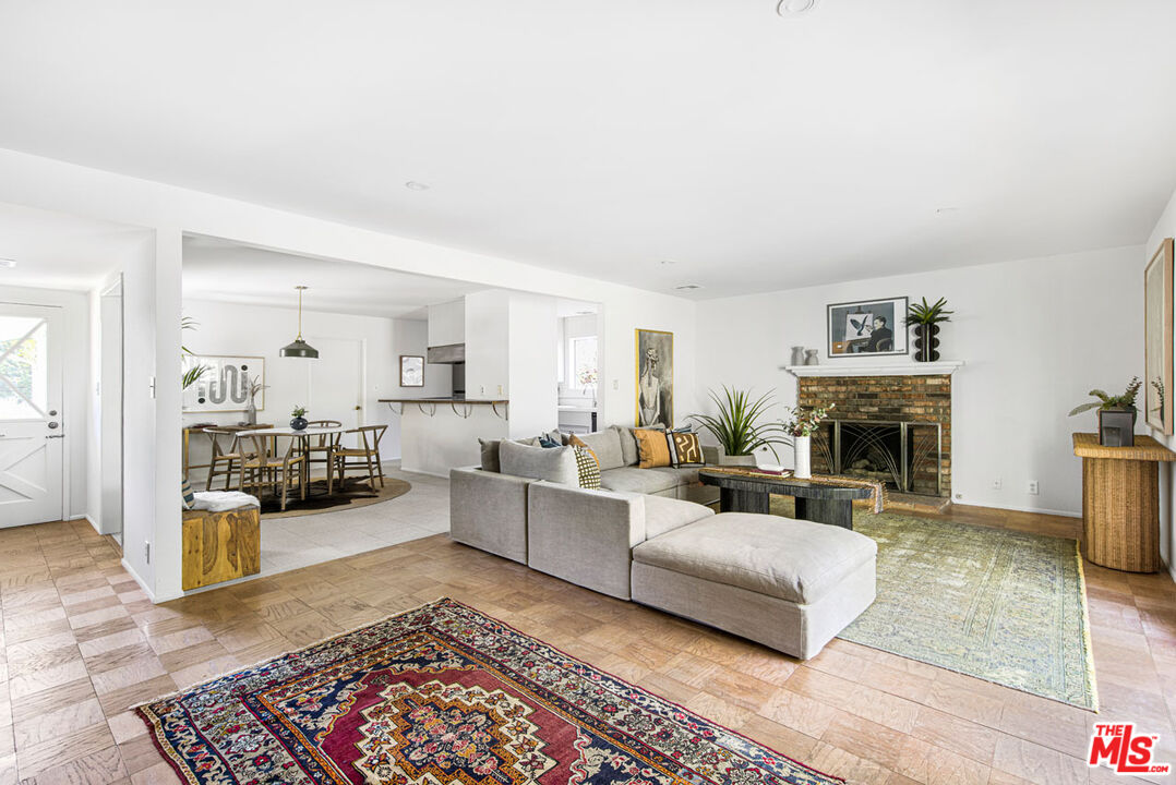 2015 Panamint Drive Los Angeles, CA 90065 - Photo 4 of 29 a living room with furniture large window and a fireplace