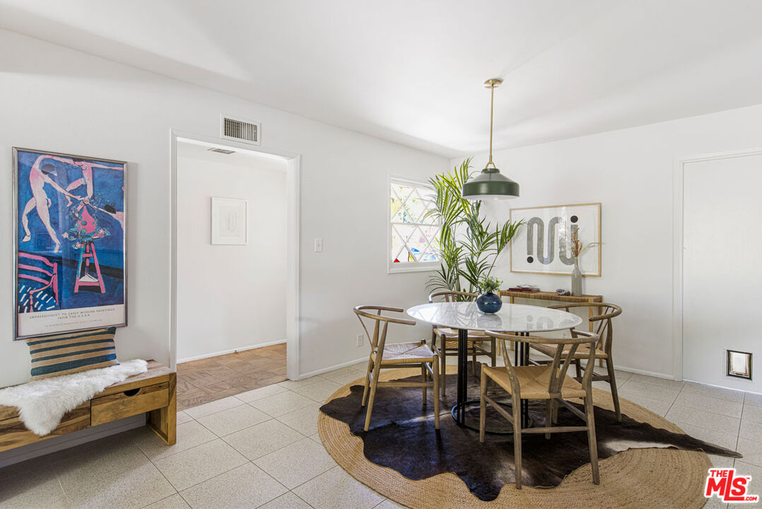 2015 Panamint Drive Los Angeles, CA 90065 - Photo 8 of 29 a view of a dining room with furniture wooden floor and a chandelier